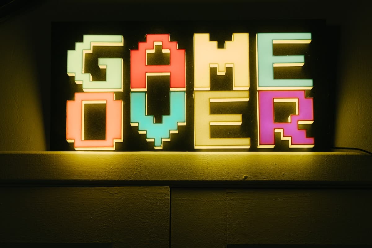 Computer screen displaying "game over" text. How to Code a Game