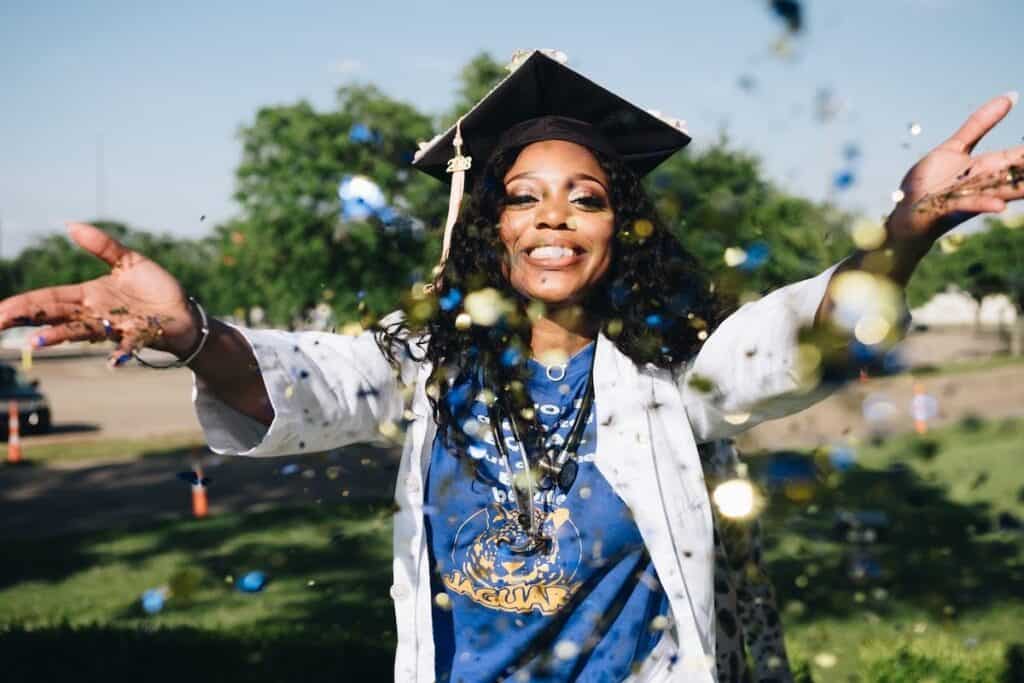 Female electrical engineering student celebrating at her graduation ceremony Scholarships for Computer Science Degrees